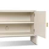 Talk about novelty. Made from painted linen in a light ivory, arched legs soften otherwise clean, modern shaping. Finished in an antique brass, half-moon iron hardware completes this media storage look. Dual rear cutouts for cord management Amethyst Home provides interior design, new home construction design consulting, vintage area rugs, and lighting in the Dallas metro area.