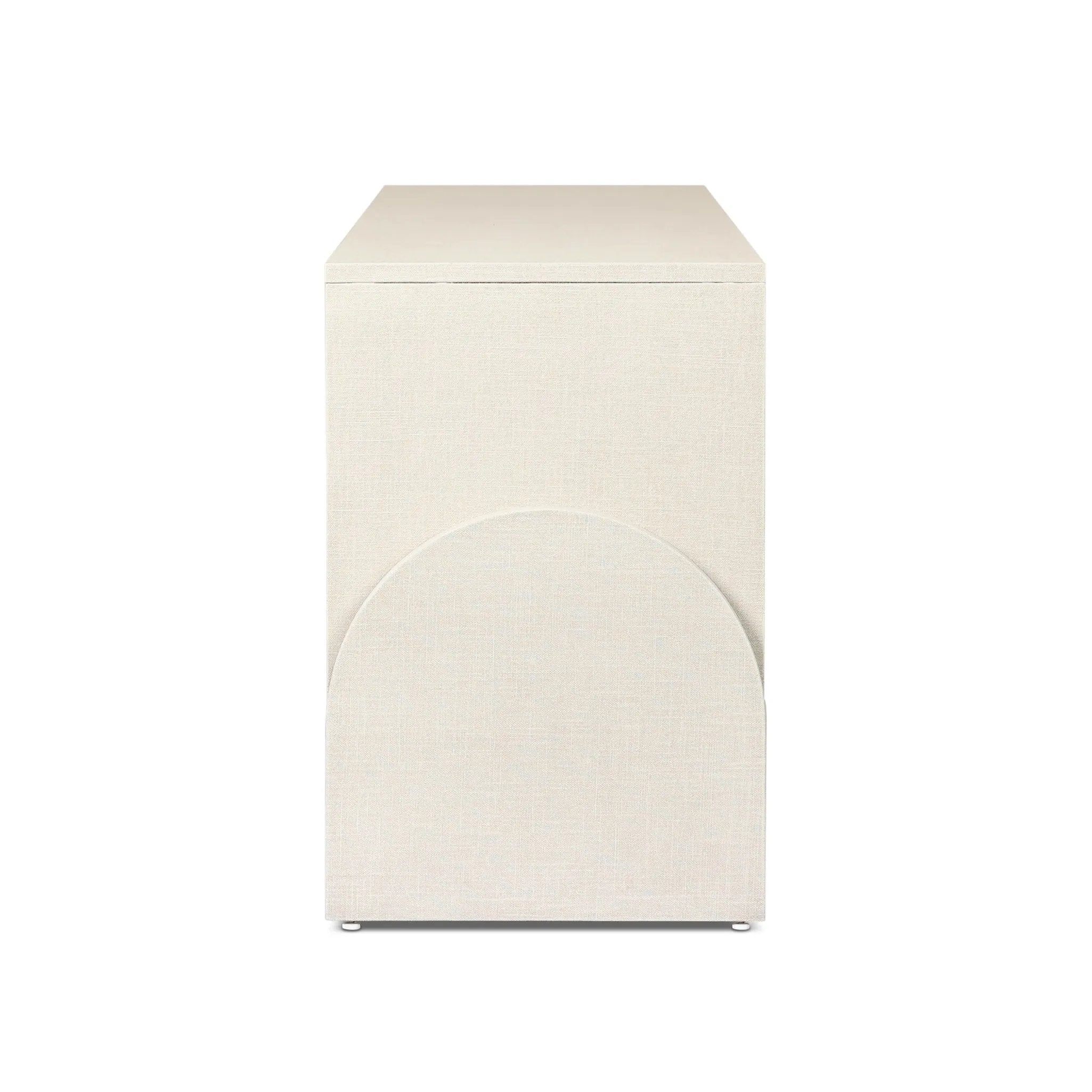 Talk about novelty. Made from painted linen in a light ivory, arched legs soften otherwise clean, modern shaping. Finished in an antique brass, half-moon iron hardware completes this media storage look. Dual rear cutouts for cord management Amethyst Home provides interior design, new home construction design consulting, vintage area rugs, and lighting in the Monterey metro area.