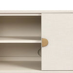 Talk about novelty. Made from painted linen in a light ivory, arched legs soften otherwise clean, modern shaping. Finished in an antique brass, half-moon iron hardware completes this media storage look. Dual rear cutouts for cord management Amethyst Home provides interior design, new home construction design consulting, vintage area rugs, and lighting in the Newport Beach metro area.