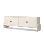 Talk about novelty. Made from painted linen in a light ivory, arched legs soften otherwise clean, modern shaping. Finished in an antique brass, half-moon iron hardware completes this media storage look. Dual rear cutouts for cord management Amethyst Home provides interior design, new home construction design consulting, vintage area rugs, and lighting in the Omaha metro area.