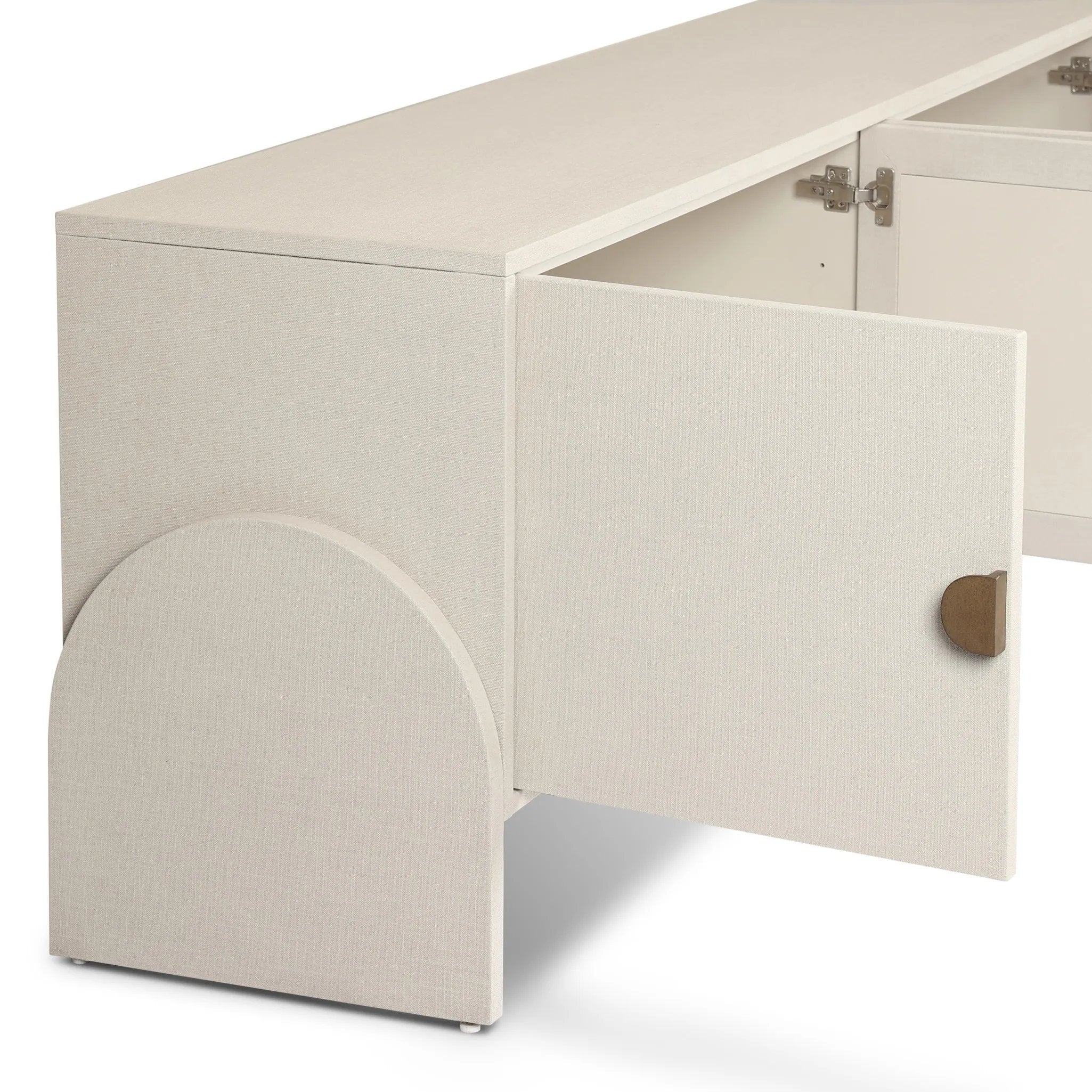 Talk about novelty. Made from painted linen in a light ivory, arched legs soften otherwise clean, modern shaping. Finished in an antique brass, half-moon iron hardware completes this media storage look. Dual rear cutouts for cord management Amethyst Home provides interior design, new home construction design consulting, vintage area rugs, and lighting in the Tampa metro area.