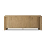 A playful placement of rounded shapes and clean lines, this sideboard captivates with half-cylinder legs seamlessly blending into the storage case and top, complete with curved metal hardware. Finished in light oak for warm, light look that can move between styles with ease Amethyst Home provides interior design, new home construction design consulting, vintage area rugs, and lighting in the Alpharetta metro area.