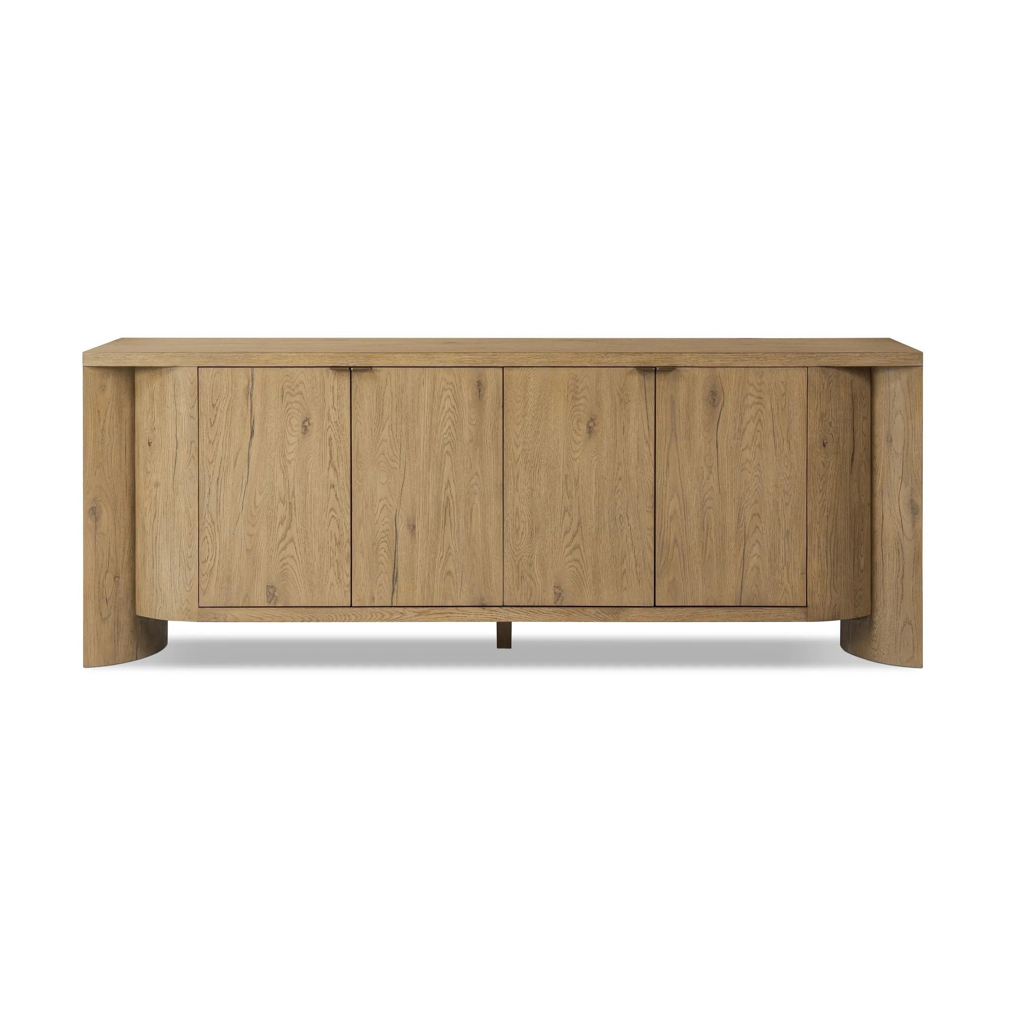 A playful placement of rounded shapes and clean lines, this sideboard captivates with half-cylinder legs seamlessly blending into the storage case and top, complete with curved metal hardware. Finished in light oak for warm, light look that can move between styles with ease Amethyst Home provides interior design, new home construction design consulting, vintage area rugs, and lighting in the Alpharetta metro area.