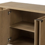 A playful placement of rounded shapes and clean lines, this sideboard captivates with half-cylinder legs seamlessly blending into the storage case and top, complete with curved metal hardware. Finished in light oak for warm, light look that can move between styles with ease Amethyst Home provides interior design, new home construction design consulting, vintage area rugs, and lighting in the Los Angeles metro area.