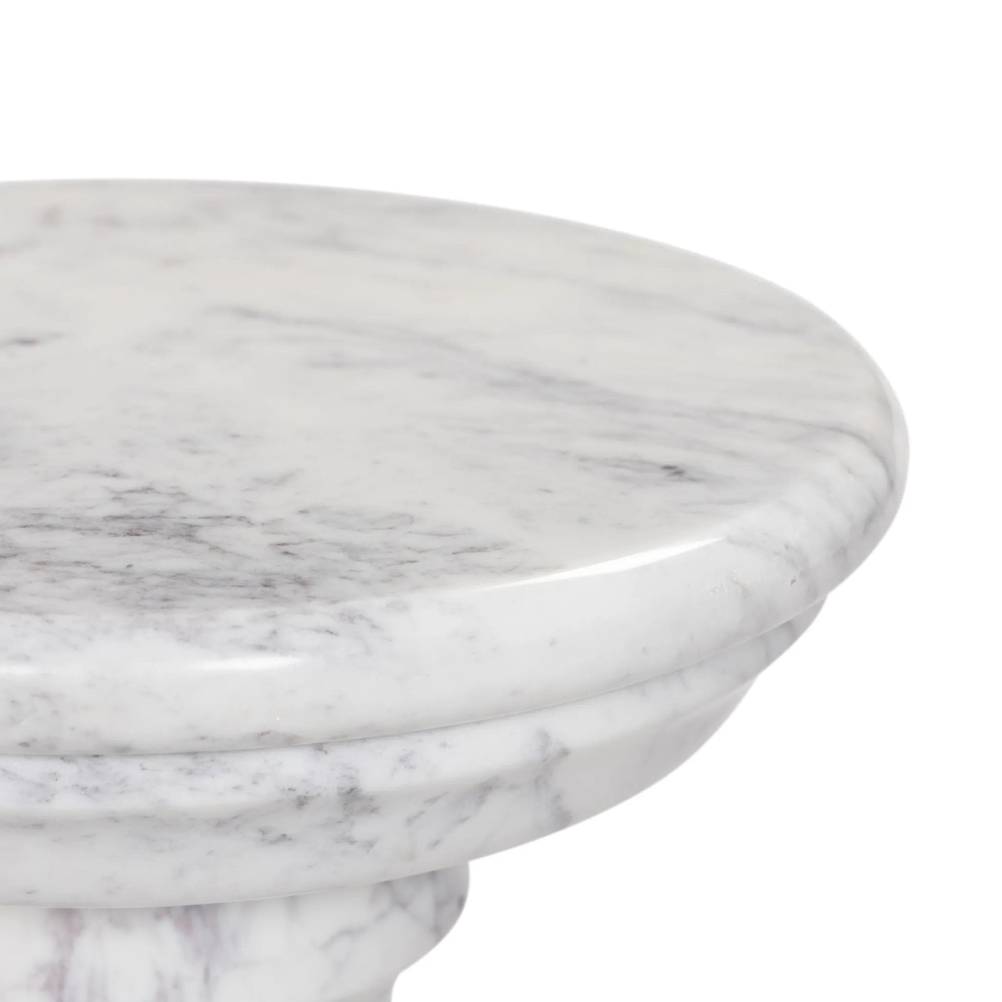 A white marble pedestal features soft curves and stepped details, inspired by classic column design. Polished to a lustrous sheen, natural veining adds depth to this versatile, timeless piece Amethyst Home provides interior design, new home construction design consulting, vintage area rugs, and lighting in the Seattle metro area.