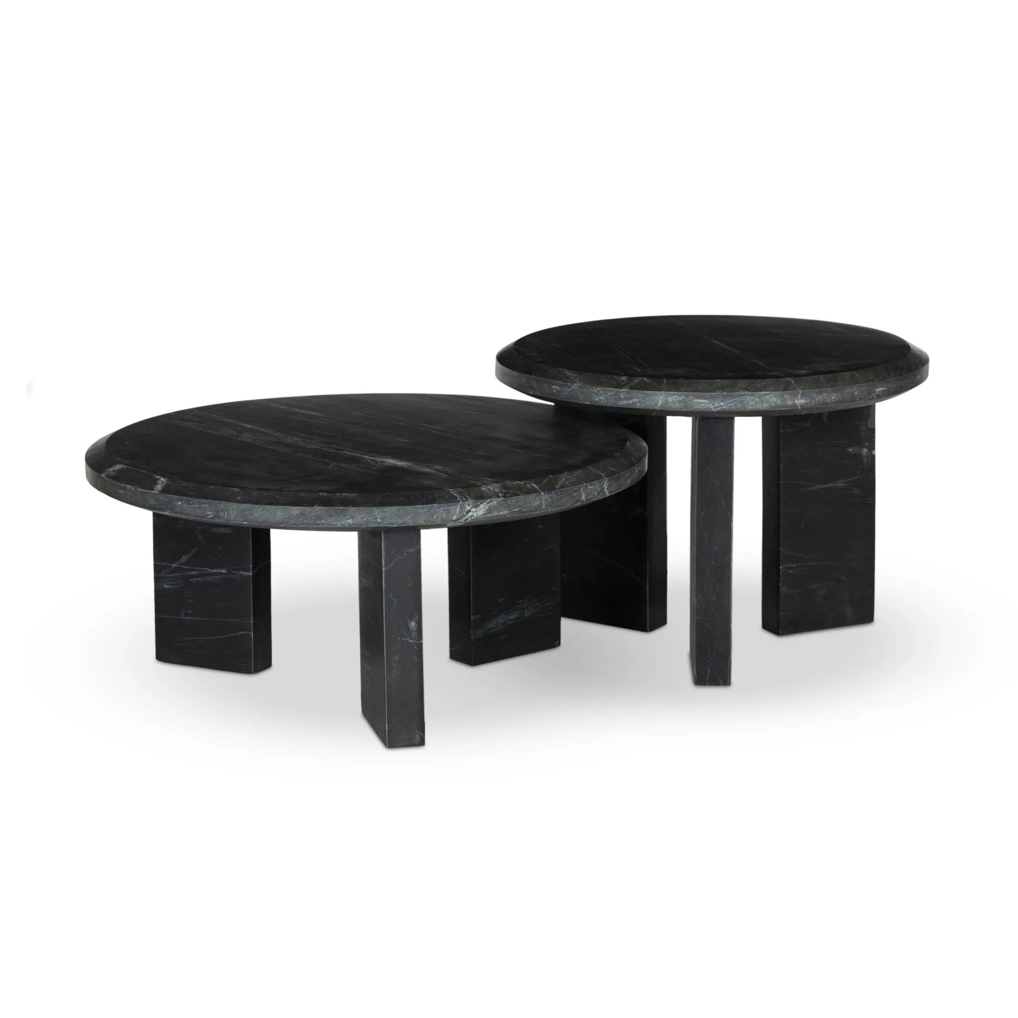 A nesting set of sculpted coffee tables, crafted of black marble with block legs and chamfered edges — perfectly sized for intimate spaces. Natural veining ensures each table is one of a kind, celebrating the natural beauty of marble Amethyst Home provides interior design, new home construction design consulting, vintage area rugs, and lighting in the Des Moines metro area.