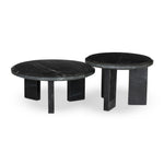 A nesting set of sculpted coffee tables, crafted of black marble with block legs and chamfered edges — perfectly sized for intimate spaces. Natural veining ensures each table is one of a kind, celebrating the natural beauty of marble Amethyst Home provides interior design, new home construction design consulting, vintage area rugs, and lighting in the Los Angeles metro area.