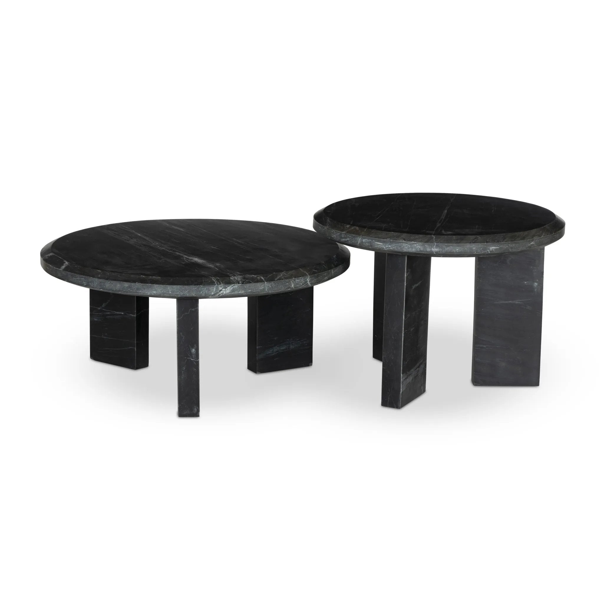 A nesting set of sculpted coffee tables, crafted of black marble with block legs and chamfered edges — perfectly sized for intimate spaces. Natural veining ensures each table is one of a kind, celebrating the natural beauty of marble Amethyst Home provides interior design, new home construction design consulting, vintage area rugs, and lighting in the Los Angeles metro area.