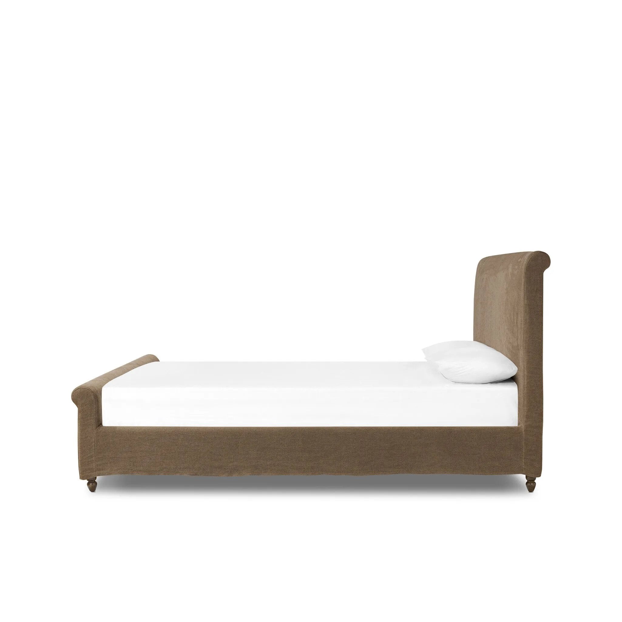 This heritage-style bed reimagines the classic sleigh silhouette. Coffee-brown, linen-like fabric slipcover is both removable and washable for practicality. Turned feet in brown parawood peek from under the slip, grounding the bed's stately charm. A design collaboration by Amber Lewis and Four Hands. Amethyst Home provides interior design, new home construction design consulting, vintage area rugs, and lighting in the Tampa metro area.