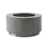 This outdoor fire table is a welcoming centerpiece designed for gathering. Made from glass-reinforced concrete, each piece is naturally finished with deep tones of pewter and dark grey. The monolithic shape is completed with lavastones in the center, bringing together a bold, monochromatic look. Amethyst Home provides interior design, new home construction design consulting, vintage area rugs, and lighting in the Tampa metro area.