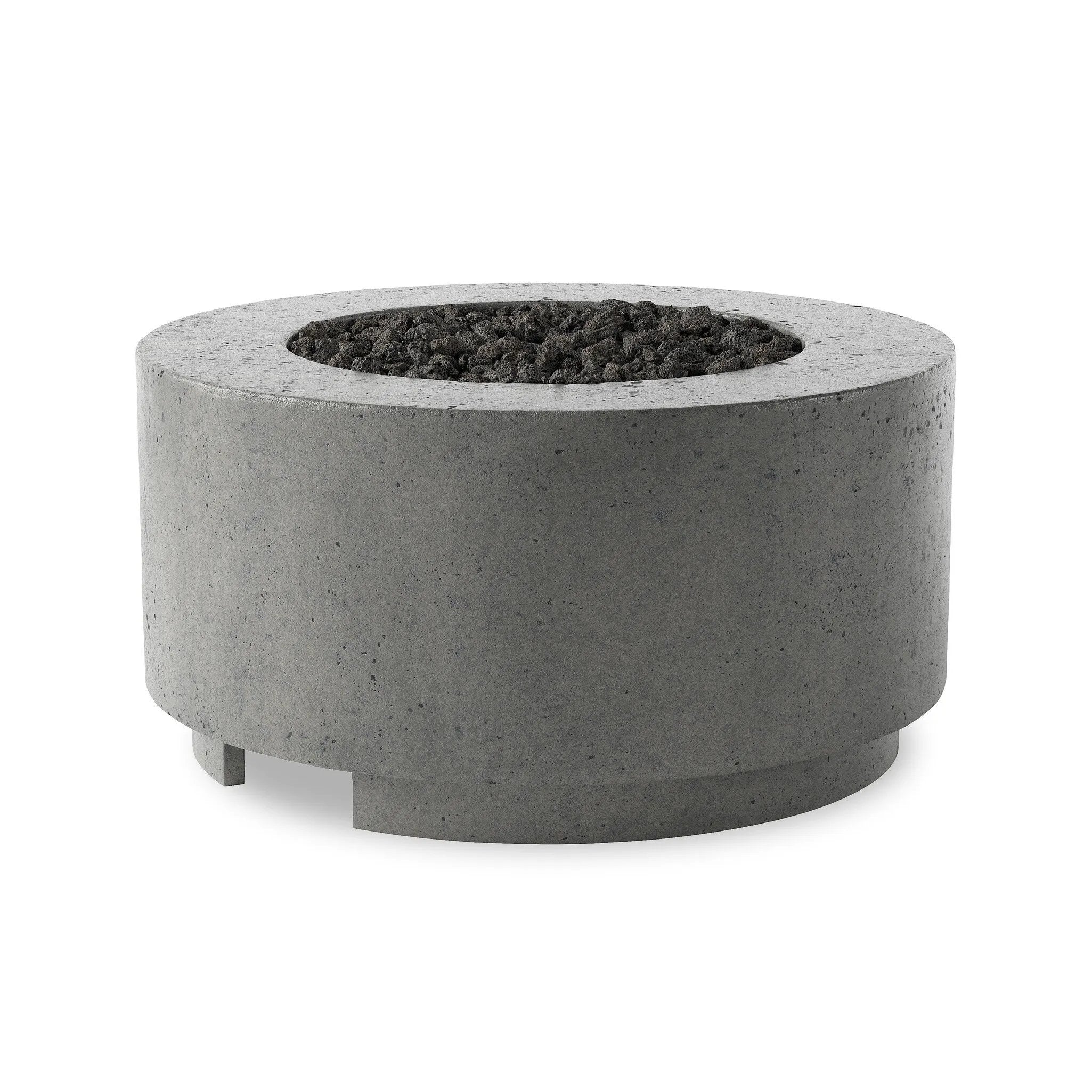 This outdoor fire table is a welcoming centerpiece designed for gathering. Made from glass-reinforced concrete, each piece is naturally finished with deep tones of pewter and dark grey. The monolithic shape is completed with lavastones in the center, bringing together a bold, monochromatic look. Amethyst Home provides interior design, new home construction design consulting, vintage area rugs, and lighting in the Tampa metro area.