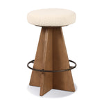 Featuring Damon Durham Cream Swivel Bar + Counter Stool by Four Hands at Amethyst Home. A gorgeous silhouette -- the Damon stool is an Amethyst fave.
Large angular panels merge to form a geometrically inspired base in this modern counter stool. The circle metal ring around the base serves as a footrest, while the round upholstered cushion provides comfortable. Amethyst Home provides interior design, new home construction design consulting, vintage area rugs, and lighting in the Seattle metro area.