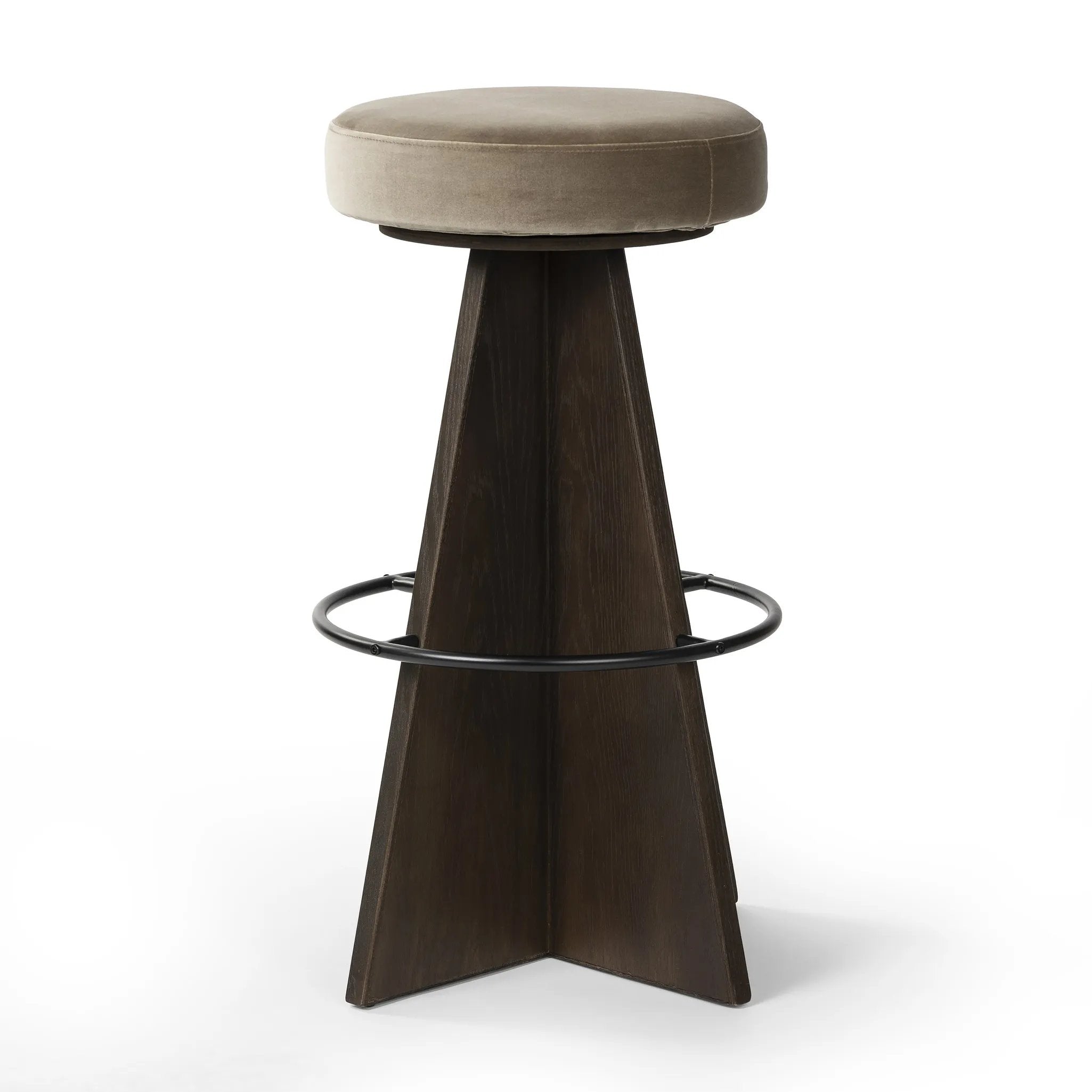 Featuring Damon Sapphire Khaki  Swivel Bar + Counter Stool by Four Hands at Amethyst Home. Large angular panels merge to form a geometrically inspired base in this modern counter stool. The circle metal ring around the base serves as a footrest, while the round upholstered cushion provides comfortable seating. The 360-degree swivel function adds versatility, a. Amethyst Home provides interior design, new home construction design consulting, vintage area rugs, and lighting in the Boston metro area.