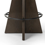 Featuring Damon Sapphire Khaki  Swivel Bar + Counter Stool by Four Hands at Amethyst Home. Large angular panels merge to form a geometrically inspired base in this modern counter stool. The circle metal ring around the base serves as a footrest, while the round upholstered cushion provides comfortable seating. The 360-degree swivel function adds versatility, an. Amethyst Home provides interior design, new home construction design consulting, vintage area rugs, and lighting in the Omaha metro area.