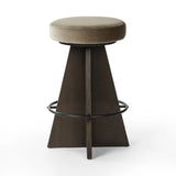 Featuring Damon Sapphire Khaki  Swivel Bar + Counter Stool by Four Hands at Amethyst Home. Large angular panels merge to form a geometrically inspired base in this modern counter stool. The circle metal ring around the base serves as a footrest, while the round upholstered cushion provides comfortable seating. The 360-degree swivel function adds versati. Amethyst Home provides interior design, new home construction design consulting, vintage area rugs, and lighting in the Winter Garden metro area.