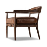 Featuring Dane Sonoma Chestnut Chair by Four Hands at Amethyst Home. Safari styling is brought to modern speed on this vintage-inspired chair. Its solid wood frame features a webbed seating structure that brings a sink-in feel to the entire piece. The upholstered back, strap details and loose cushion are finished in carbon neutral, vegetable-tanned leather. Amethyst Home provides interior design, new home construction design consulting, vintage area rugs, and lighting in the Alpharetta metro area.