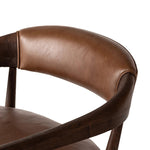 Featuring Dane Sonoma Chestnut Chair by Four Hands at Amethyst Home. Safari styling is brought to modern speed on this vintage-inspired chair. Its solid wood frame features a webbed seating structure that brings a sink-in feel to the entire piece. The upholstered back, strap details and loose cushion are finished in carbon neutral, vegetable-tanned leathe. Amethyst Home provides interior design, new home construction design consulting, vintage area rugs, and lighting in the Los Angeles metro area.