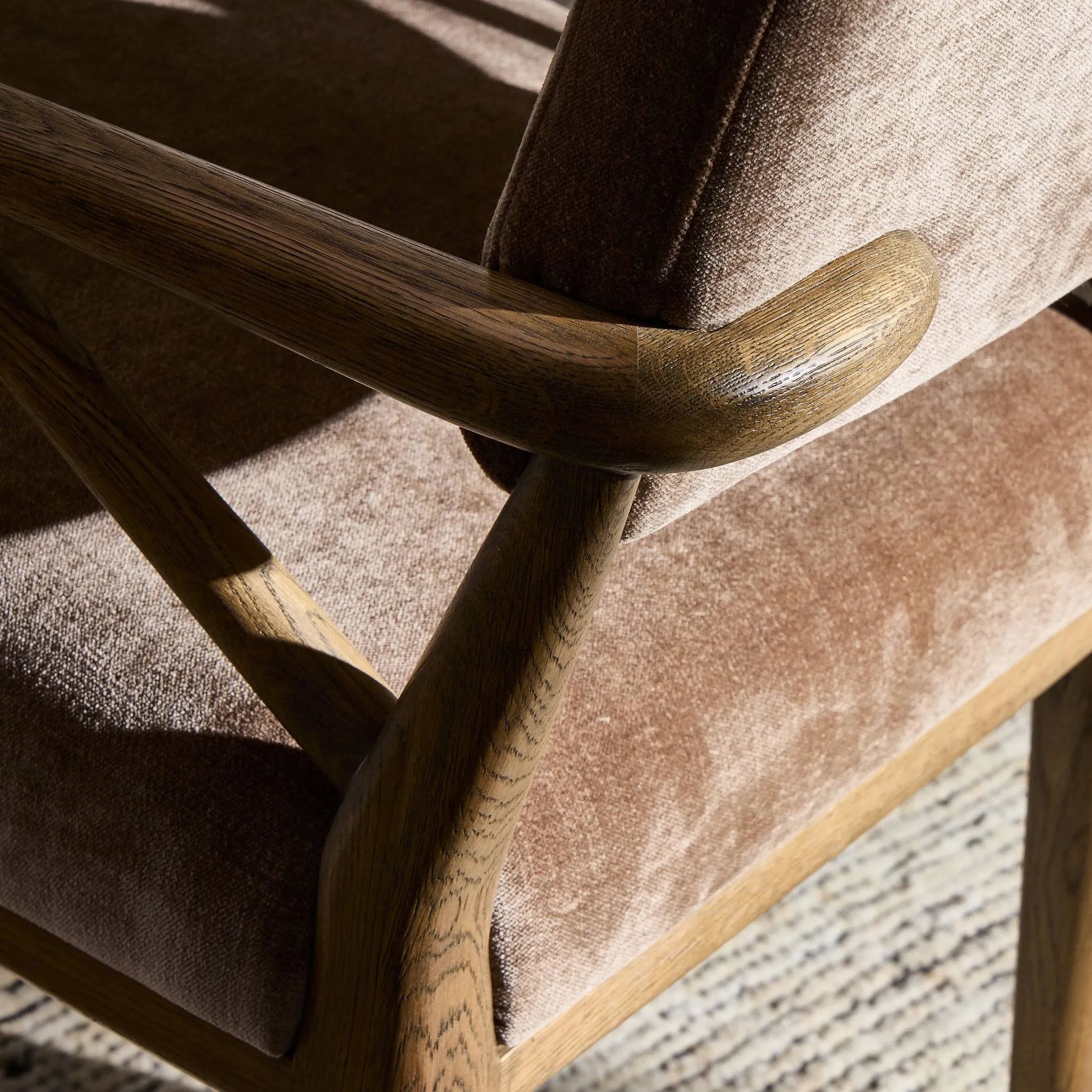 Pastoral inspiration defines a thoughtfully designed dining chair of toasted oak, while soft earthen upholstery covers a comfortable seat and back Amethyst Home provides interior design, new home construction design consulting, vintage area rugs, and lighting in the Laguna Beach metro area.