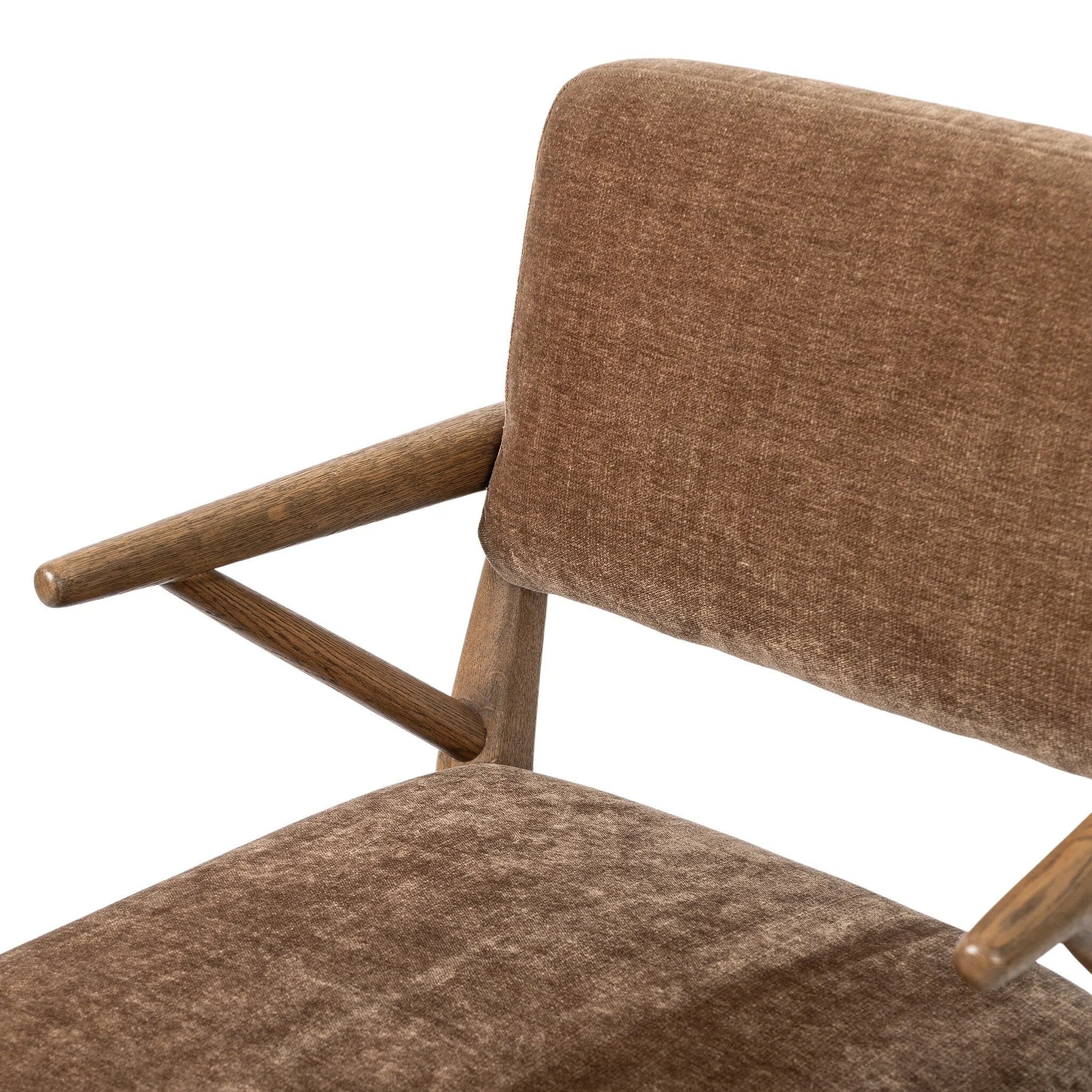 Pastoral inspiration defines a thoughtfully designed dining chair of toasted oak, while soft earthen upholstery covers a comfortable seat and back Amethyst Home provides interior design, new home construction design consulting, vintage area rugs, and lighting in the Nashville metro area.