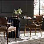 Pastoral inspiration defines a thoughtfully designed dining chair of toasted oak, while soft earthen upholstery covers a comfortable seat and back Amethyst Home provides interior design, new home construction design consulting, vintage area rugs, and lighting in the Tampa metro area.