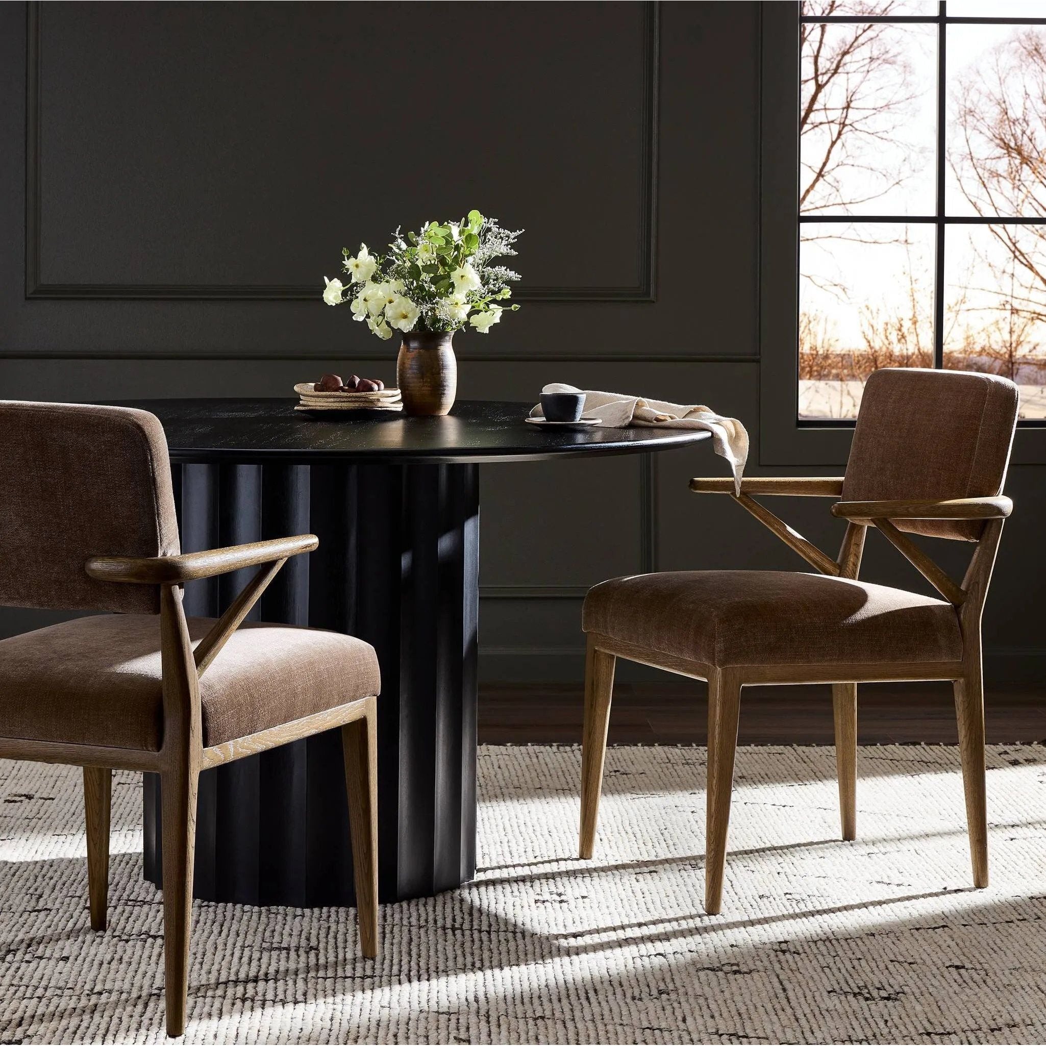 Pastoral inspiration defines a thoughtfully designed dining chair of toasted oak, while soft earthen upholstery covers a comfortable seat and back Amethyst Home provides interior design, new home construction design consulting, vintage area rugs, and lighting in the Tampa metro area.