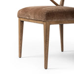 Pastoral inspiration defines a thoughtfully designed dining chair of toasted oak, while soft earthen upholstery covers a comfortable seat and back Amethyst Home provides interior design, new home construction design consulting, vintage area rugs, and lighting in the Winter Garden metro area.