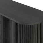 Crafted from desert oak solids and veneers with a plinth-style base, rounded sides and linear reeding, this sideboard exudes midcentury vibes. Fully finished interior and shelves for quality detailing inside and out.As enthusiasts of luxe style at Amethyst, we love the warm modern inspired Delphi Media Console - Cerused Black Oak. Amethyst Home provides interior design, new home construction design consulting, vintage area rugs, and lighting in the Los Angeles metro area.