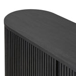 Crafted from desert oak solids and veneers with a plinth-style base, rounded sides and linear reeding, this sideboard exudes midcentury vibes. Fully finished interior and shelves for quality detailing inside and out.As enthusiasts of luxe style at Amethyst, we love the warm modern inspired Delphi Media Console - Cerused Black Oak. Amethyst Home provides interior design, new home construction design consulting, vintage area rugs, and lighting in the Omaha metro area.