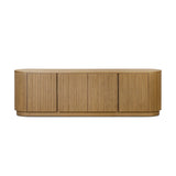 Crafted from desert oak solids and veneers with a plinth-style base, rounded sides and linear reeding, this sideboard exudes midcentury vibes.  Fully finished interior and shelves for quality detailing inside and out Amethyst Home provides interior design, new home construction design consulting, vintage area rugs, and lighting in the Dallas metro area.