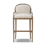 A tribute to traditional artistry and found pieces, this bar stool fluidly combines ash and burnished brass to frame a comfortable S-spring seat. Finished in heavy boucle-like upholstery that features a subtle linear pattern for added depth — creating a luxe, inviting feel. A design collaboration by Amber Lewis and Four Hands. Amethyst Home provides interior design, new home construction design consulting, vintage area rugs, and lighting in the Scottsdale metro area.
