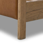 Slightly scooped top-grain leather tufting is bridged with metal bars in brushed brass for modern detailing. Aged smoked oak frames the three-paneled headboard and footboard wrapped in chestnut top-grain leather. Rounded legs soften the look Amethyst Home provides interior design, new home construction design consulting, vintage area rugs, and lighting in the Dallas metro area.