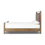 Slightly scooped top-grain leather tufting is bridged with metal bars in brushed brass for modern detailing. Aged smoked oak frames the three-paneled headboard and footboard wrapped in chestnut top-grain leather. Rounded legs soften the look Amethyst Home provides interior design, new home construction design consulting, vintage area rugs, and lighting in the Laguna Beach metro area.