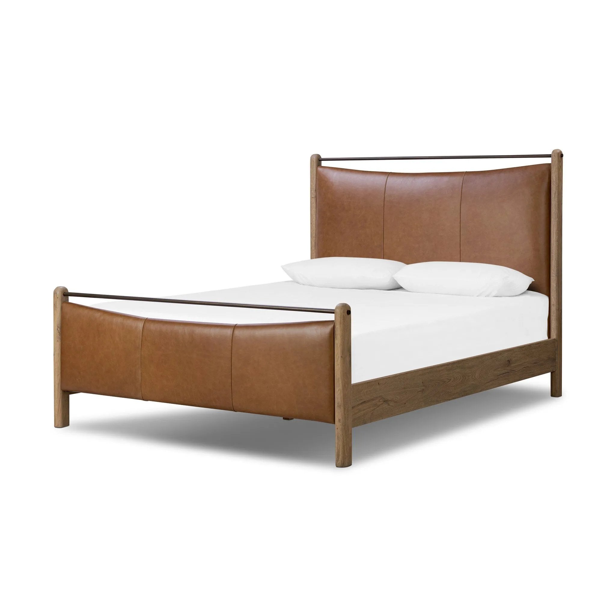 Slightly scooped top-grain leather tufting is bridged with metal bars in brushed brass for modern detailing. Aged smoked oak frames the three-paneled headboard and footboard wrapped in chestnut top-grain leather. Rounded legs soften the look Amethyst Home provides interior design, new home construction design consulting, vintage area rugs, and lighting in the Monterey metro area.