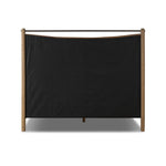 Slightly scooped top-grain leather tufting is bridged with metal bars in brushed brass for modern detailing. Aged smoked oak frames the three-paneled headboard and footboard wrapped in chestnut top-grain leather. Rounded legs soften the look Amethyst Home provides interior design, new home construction design consulting, vintage area rugs, and lighting in the Seattle metro area.