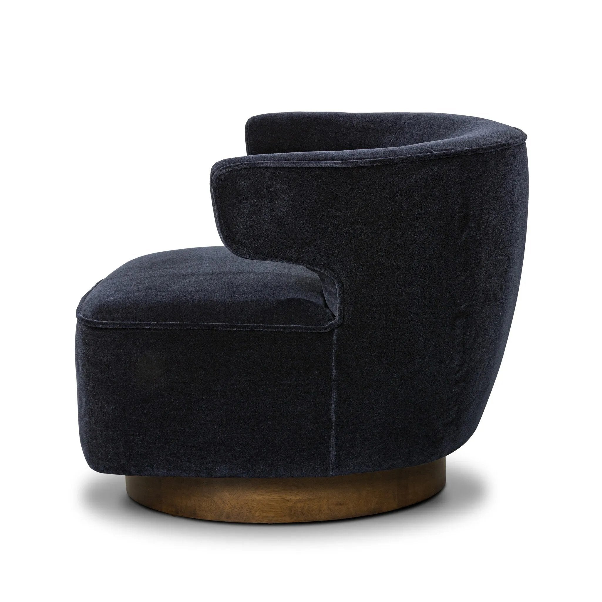 The continuous form of this swivel chair creates a sleek look that elevates everyday seating. Upholstered in navy wool blend, its sleek design is complemented by a 360-degree swivel and pedestal base of solid parawood for a mixed media moment Amethyst Home provides interior design, new home construction design consulting, vintage area rugs, and lighting in the Austin metro area.