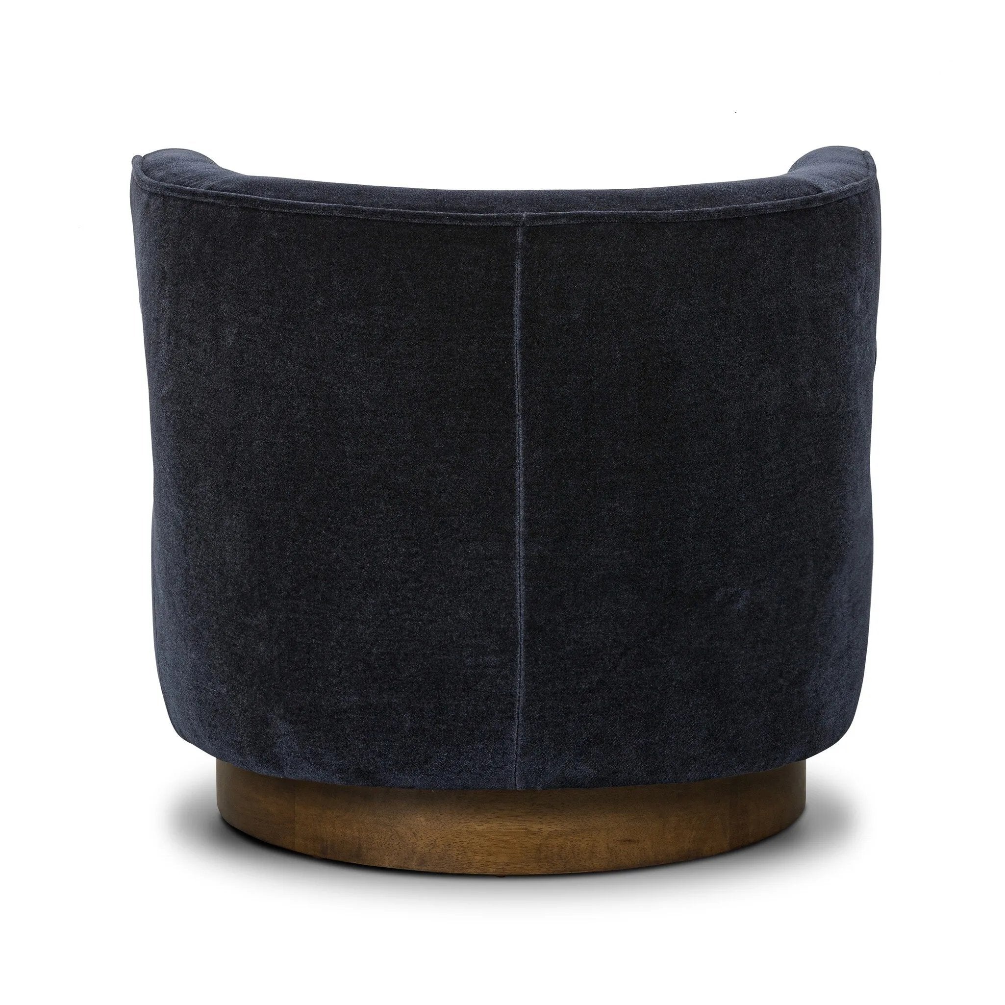 The continuous form of this swivel chair creates a sleek look that elevates everyday seating. Upholstered in navy wool blend, its sleek design is complemented by a 360-degree swivel and pedestal base of solid parawood for a mixed media moment Amethyst Home provides interior design, new home construction design consulting, vintage area rugs, and lighting in the Des Moines metro area.