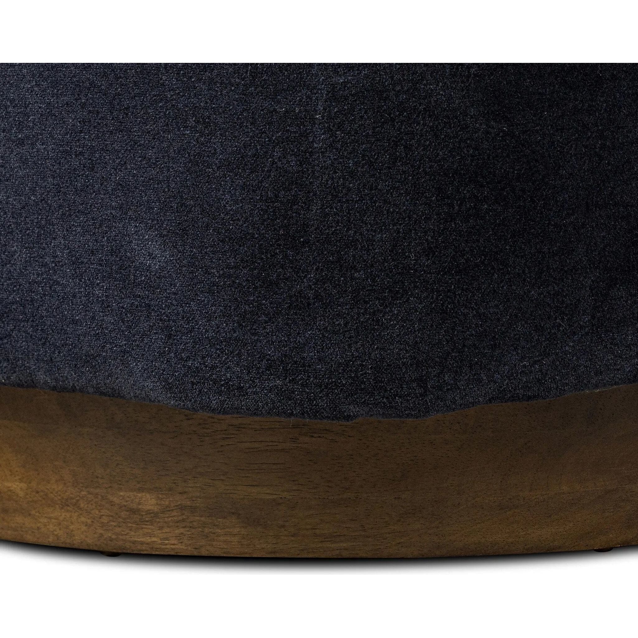 The continuous form of this swivel chair creates a sleek look that elevates everyday seating. Upholstered in navy wool blend, its sleek design is complemented by a 360-degree swivel and pedestal base of solid parawood for a mixed media moment Amethyst Home provides interior design, new home construction design consulting, vintage area rugs, and lighting in the Houston metro area.