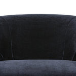 The continuous form of this swivel chair creates a sleek look that elevates everyday seating. Upholstered in navy wool blend, its sleek design is complemented by a 360-degree swivel and pedestal base of solid parawood for a mixed media moment Amethyst Home provides interior design, new home construction design consulting, vintage area rugs, and lighting in the Los Angeles metro area.