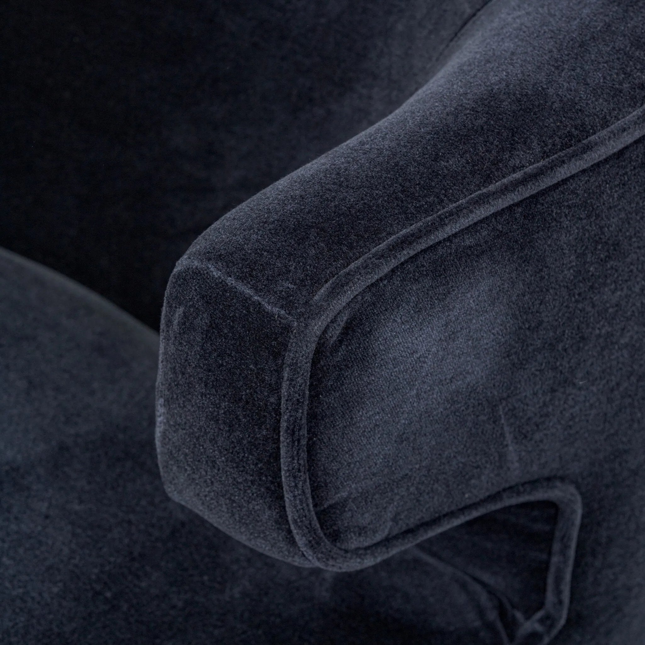 The continuous form of this swivel chair creates a sleek look that elevates everyday seating. Upholstered in navy wool blend, its sleek design is complemented by a 360-degree swivel and pedestal base of solid parawood for a mixed media moment Amethyst Home provides interior design, new home construction design consulting, vintage area rugs, and lighting in the Salt Lake City metro area.