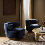 The continuous form of this swivel chair creates a sleek look that elevates everyday seating. Upholstered in navy wool blend, its sleek design is complemented by a 360-degree swivel and pedestal base of solid parawood for a mixed media moment Amethyst Home provides interior design, new home construction design consulting, vintage area rugs, and lighting in the Winter Garden metro area.