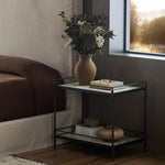 Bring a touch of heritage charm to your bedroom with this two-tier metal nightstand. An aged rust finish complements solid marble shelves with stripe-like veining, finished out with turned legs and gallery edging Amethyst Home provides interior design, new home construction design consulting, vintage area rugs, and lighting in the Dallas metro area.