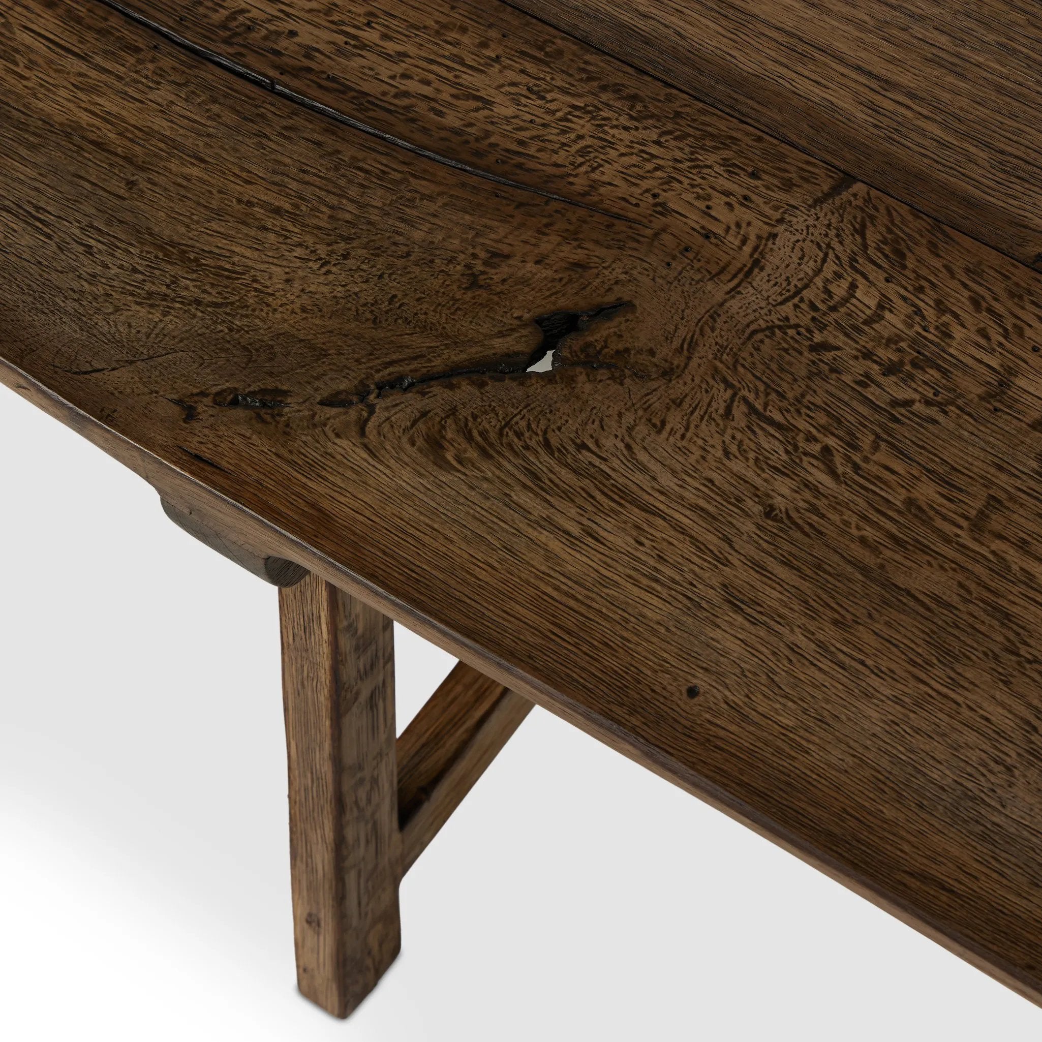 This Wabi Sabi-inspired accent bench feels like a family heirloom, thanks to the timeless look of burnt bleached oak. A trellis base, wide planked top and natural cracks and graining reflect the artisanship behind this special found-feeling pieces Amethyst Home provides interior design, new home construction design consulting, vintage area rugs, and lighting in the Des Moines metro area.