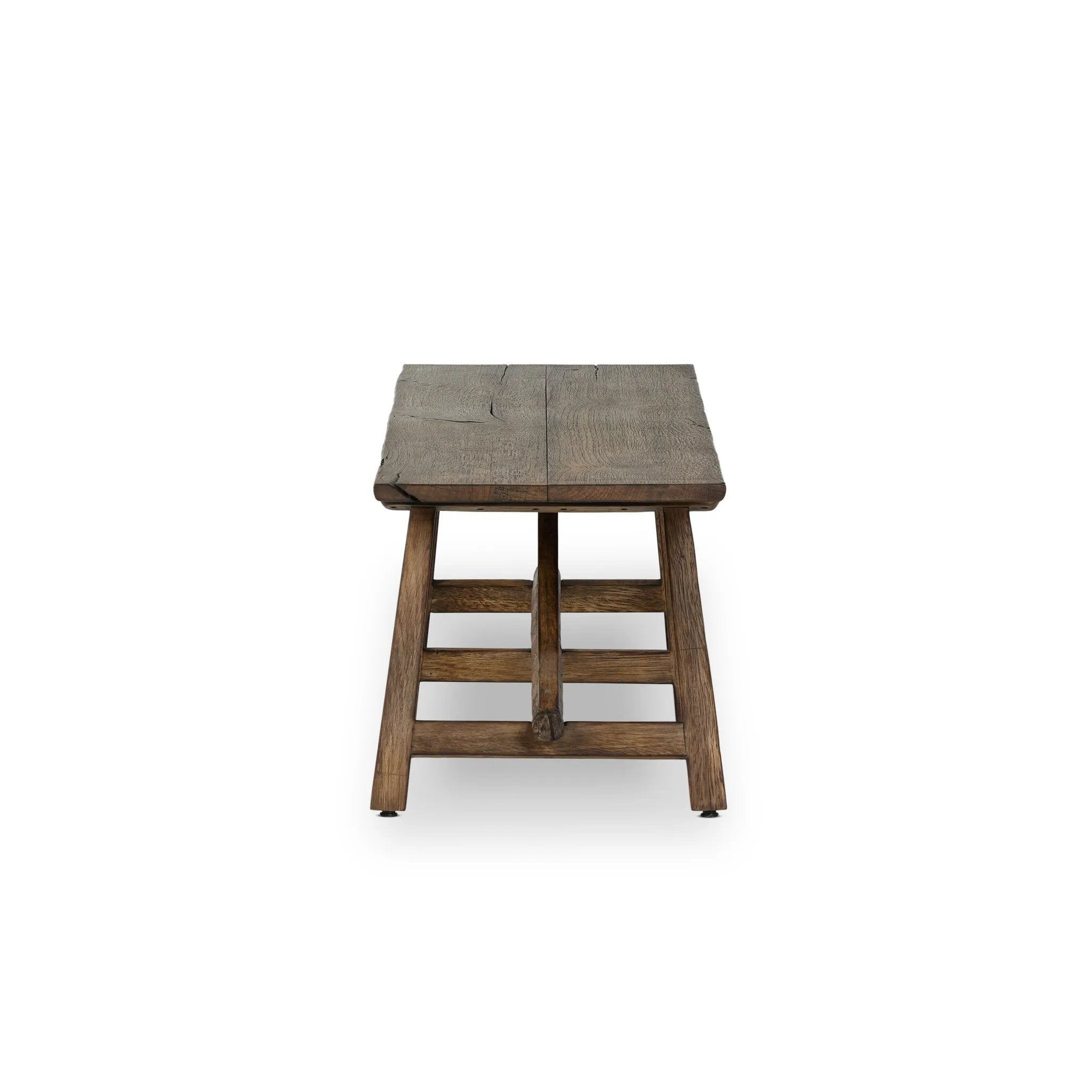 This Wabi Sabi-inspired accent bench feels like a family heirloom, thanks to the timeless look of burnt bleached oak. A trellis base, wide planked top and natural cracks and graining reflect the artisanship behind this special found-feeling pieces Amethyst Home provides interior design, new home construction design consulting, vintage area rugs, and lighting in the Houston metro area.