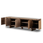 A clean-styled media console made from warm, grain-rich oak. Six doors feature subtle finger grooves for easy open. Gentle curves soften up the look, while a floating design keeps things feeling light and fresh. Inside, generous shelving awaits storage of media and more. Amethyst Home provides interior design, new home construction design consulting, vintage area rugs, and lighting in the Calabasas metro area.