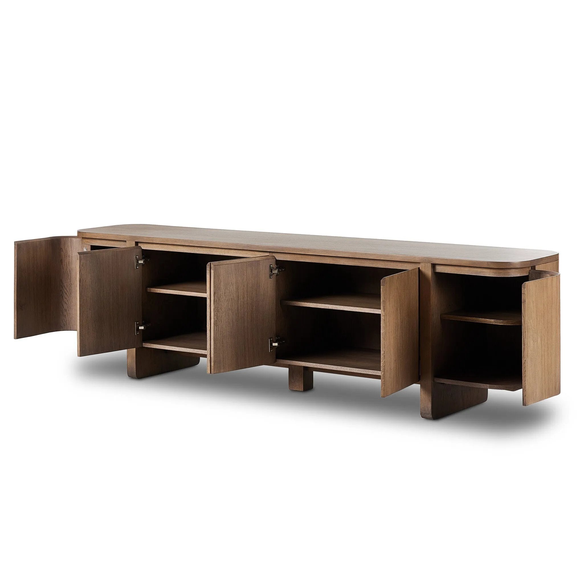 A clean-styled media console made from warm, grain-rich oak. Six doors feature subtle finger grooves for easy open. Gentle curves soften up the look, while a floating design keeps things feeling light and fresh. Inside, generous shelving awaits storage of media and more. Amethyst Home provides interior design, new home construction design consulting, vintage area rugs, and lighting in the Calabasas metro area.