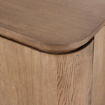 A clean-styled media console made from warm, grain-rich oak. Six doors feature subtle finger grooves for easy open. Gentle curves soften up the look, while a floating design keeps things feeling light and fresh. Inside, generous shelving awaits storage of media and more. Amethyst Home provides interior design, new home construction design consulting, vintage area rugs, and lighting in the San Diego metro area.