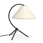 A dramatically curved silhouette and tripod base of matte black metal pair with a flax linen shade for a shapely, minimalist feel Amethyst Home provides interior design, new home construction design consulting, vintage area rugs, and lighting in the Alpharetta metro area.
