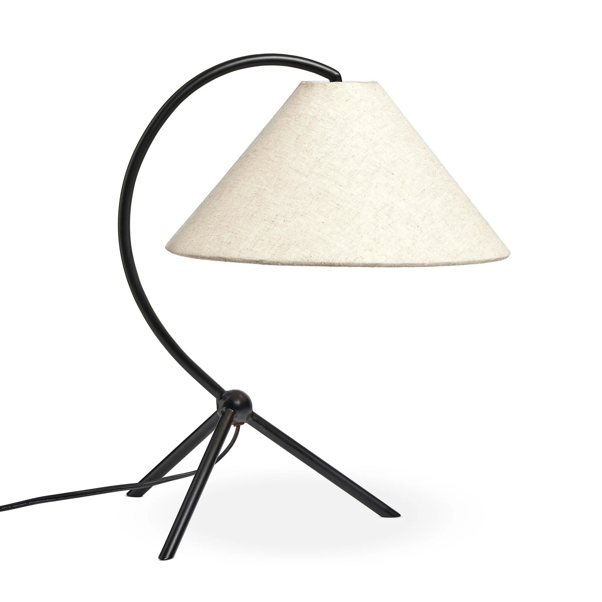 A dramatically curved silhouette and tripod base of matte black metal pair with a flax linen shade for a shapely, minimalist feel Amethyst Home provides interior design, new home construction design consulting, vintage area rugs, and lighting in the Alpharetta metro area.