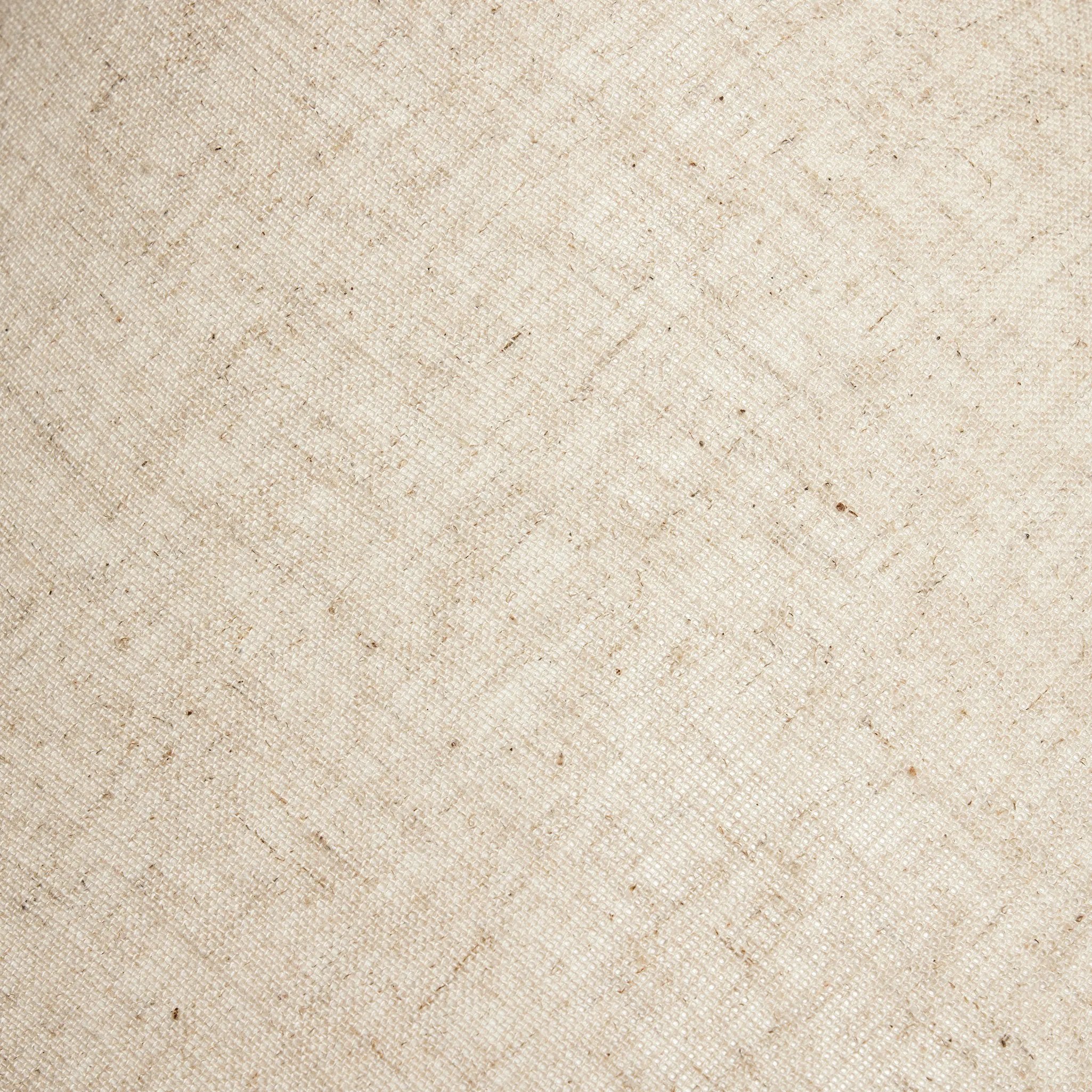 A dramatically curved silhouette and tripod base of matte black metal pair with a flax linen shade for a shapely, minimalist feel Amethyst Home provides interior design, new home construction design consulting, vintage area rugs, and lighting in the Salt Lake City metro area.
