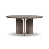 Inspired by minimalist Nordic design, a grey-finished oak dining table has a base of four plinth legs for a simple but impactful detail Amethyst Home provides interior design, new home construction design consulting, vintage area rugs, and lighting in the Houston metro area.